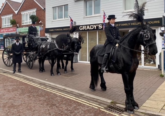 A horse drawn hearse